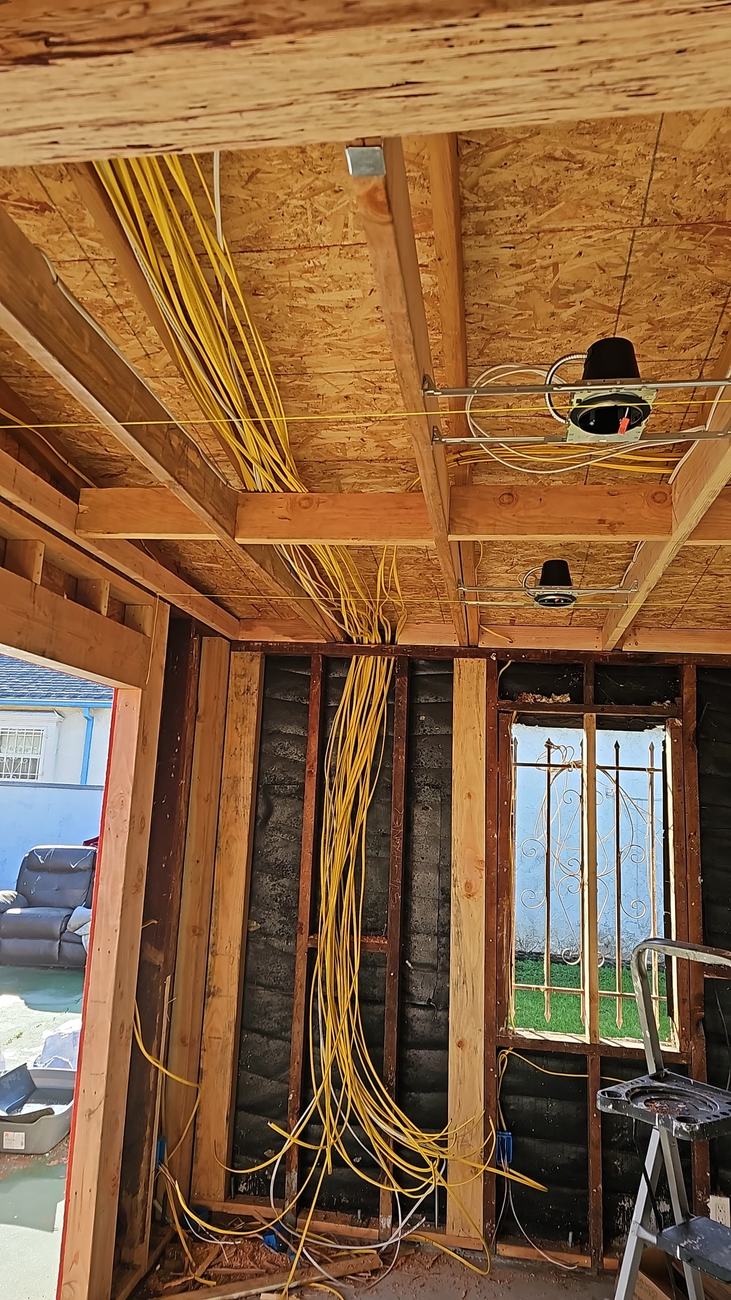 Garage-to-ADU conversion mid-construction with framing and electrical rough-in by Green Rise Builders