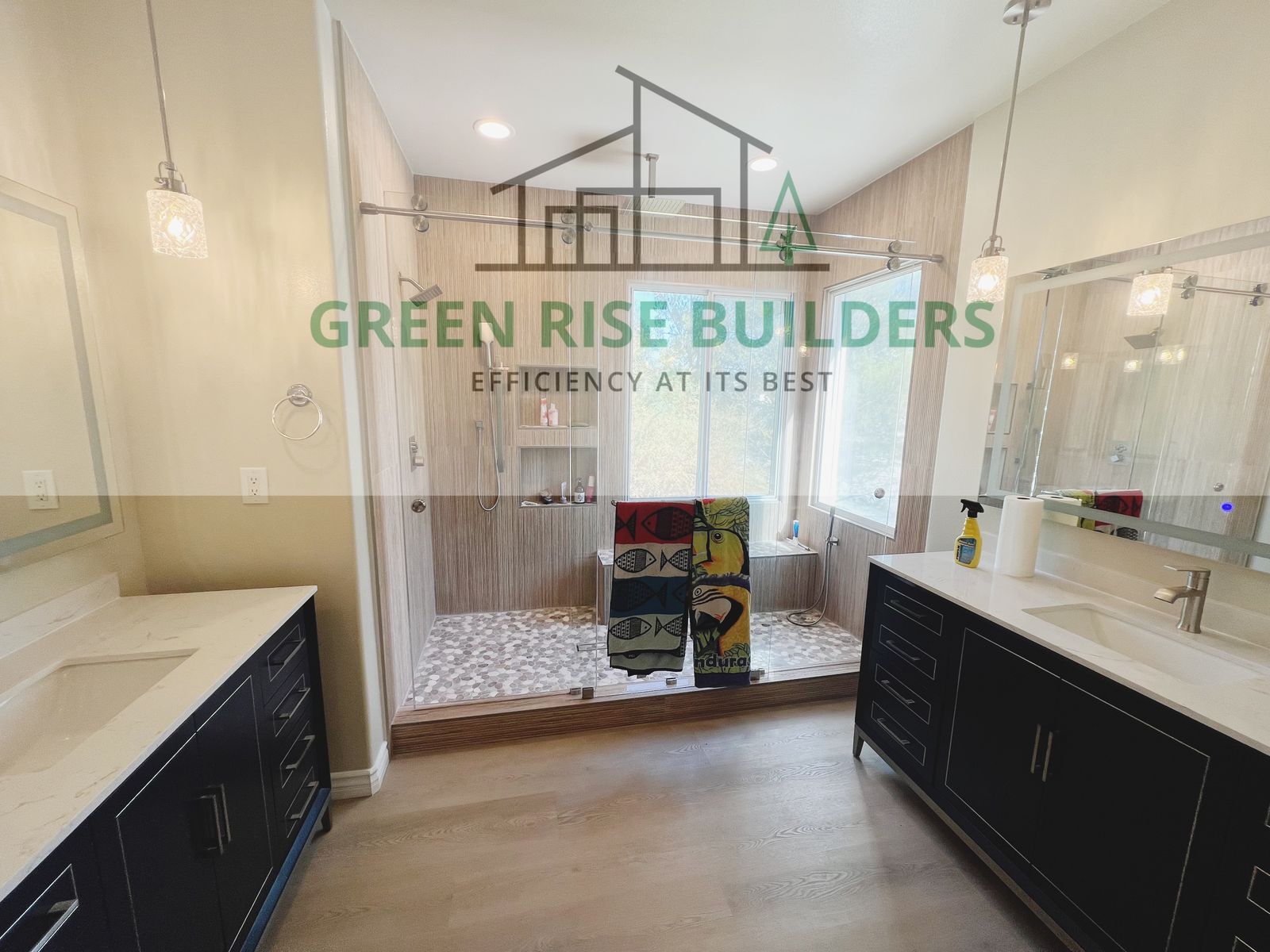 Dual-vanity bathroom remodel with walk-in shower by Green Rise Builders