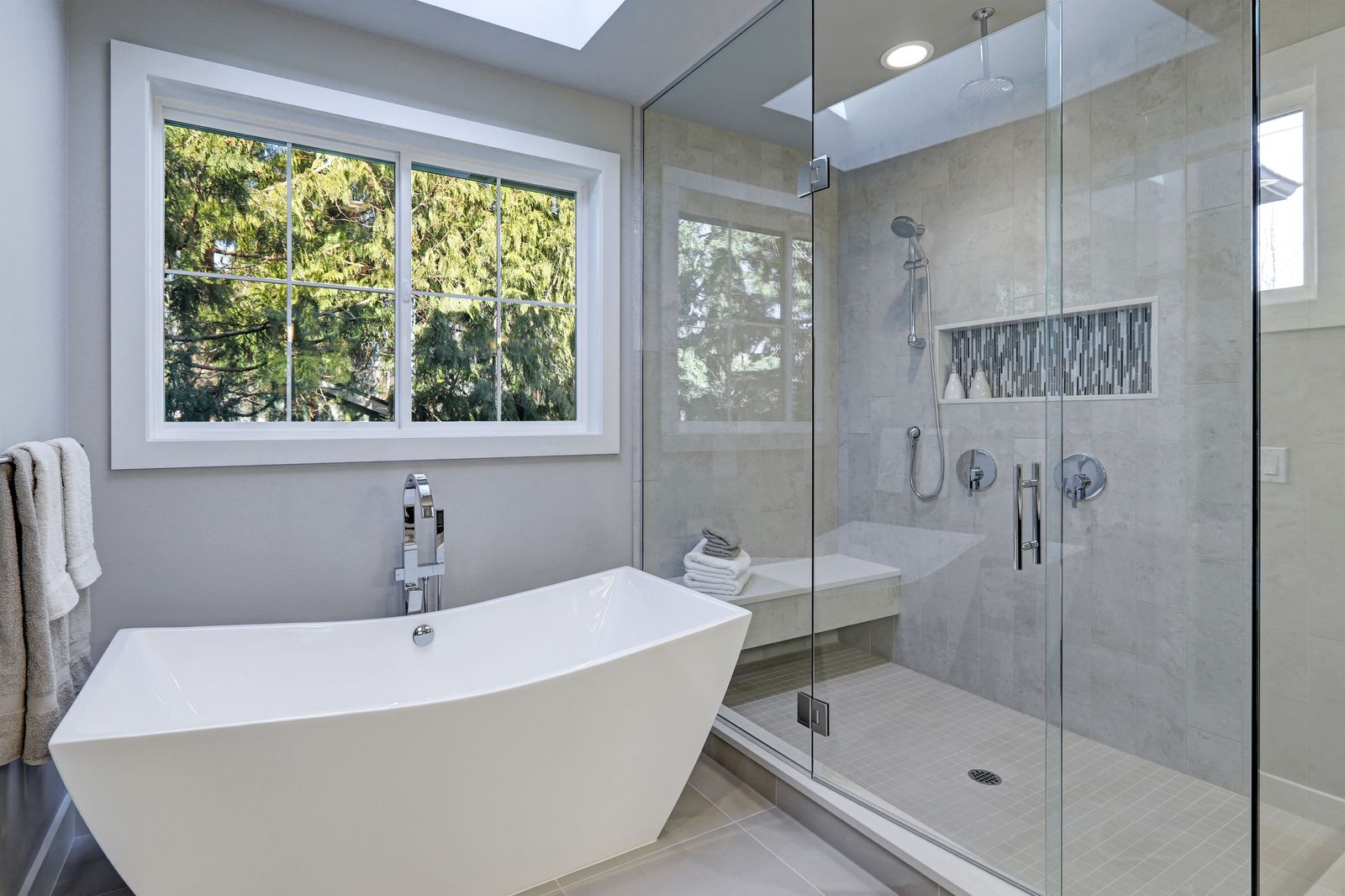 Spa-style bathroom remodel with skylight by Green Rise Builders