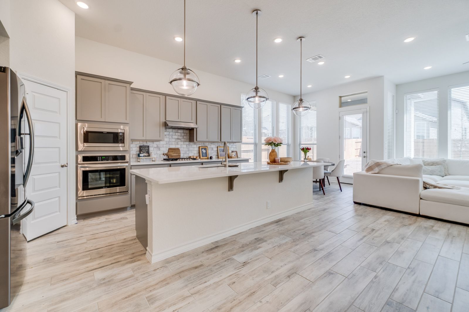 Open concept kitchen and living space remodel by Green Rise Builders